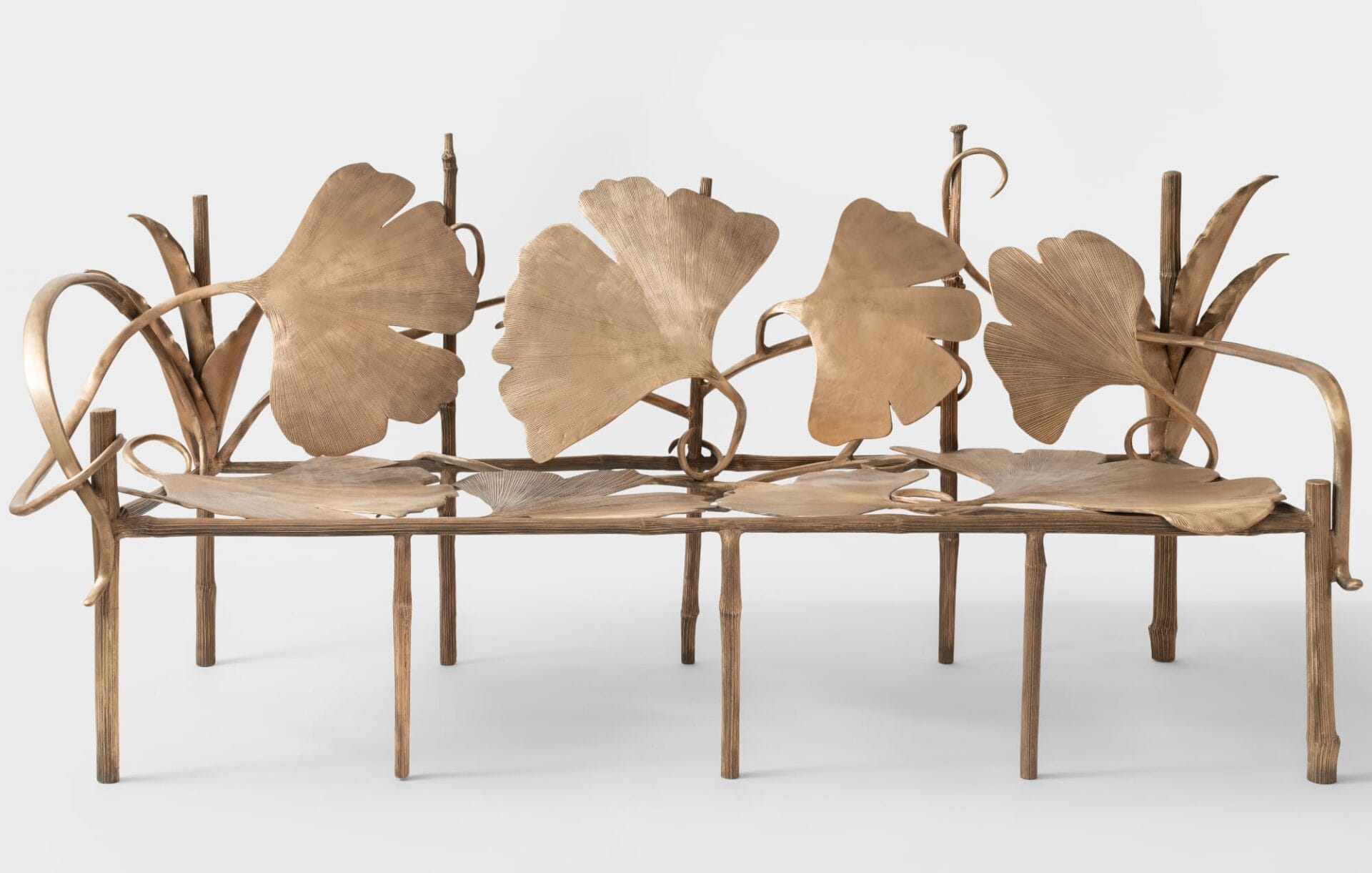 a bronze bench made of gingko leaves