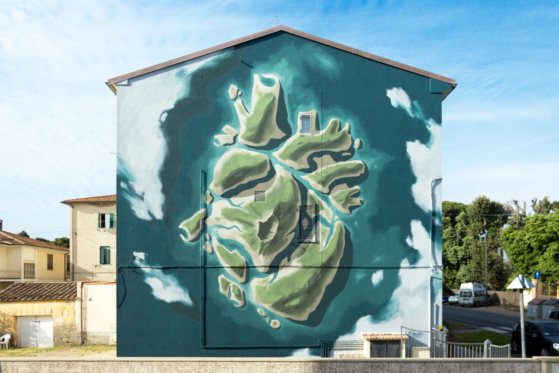 a mural of a human heart that resembles an island as seen from above